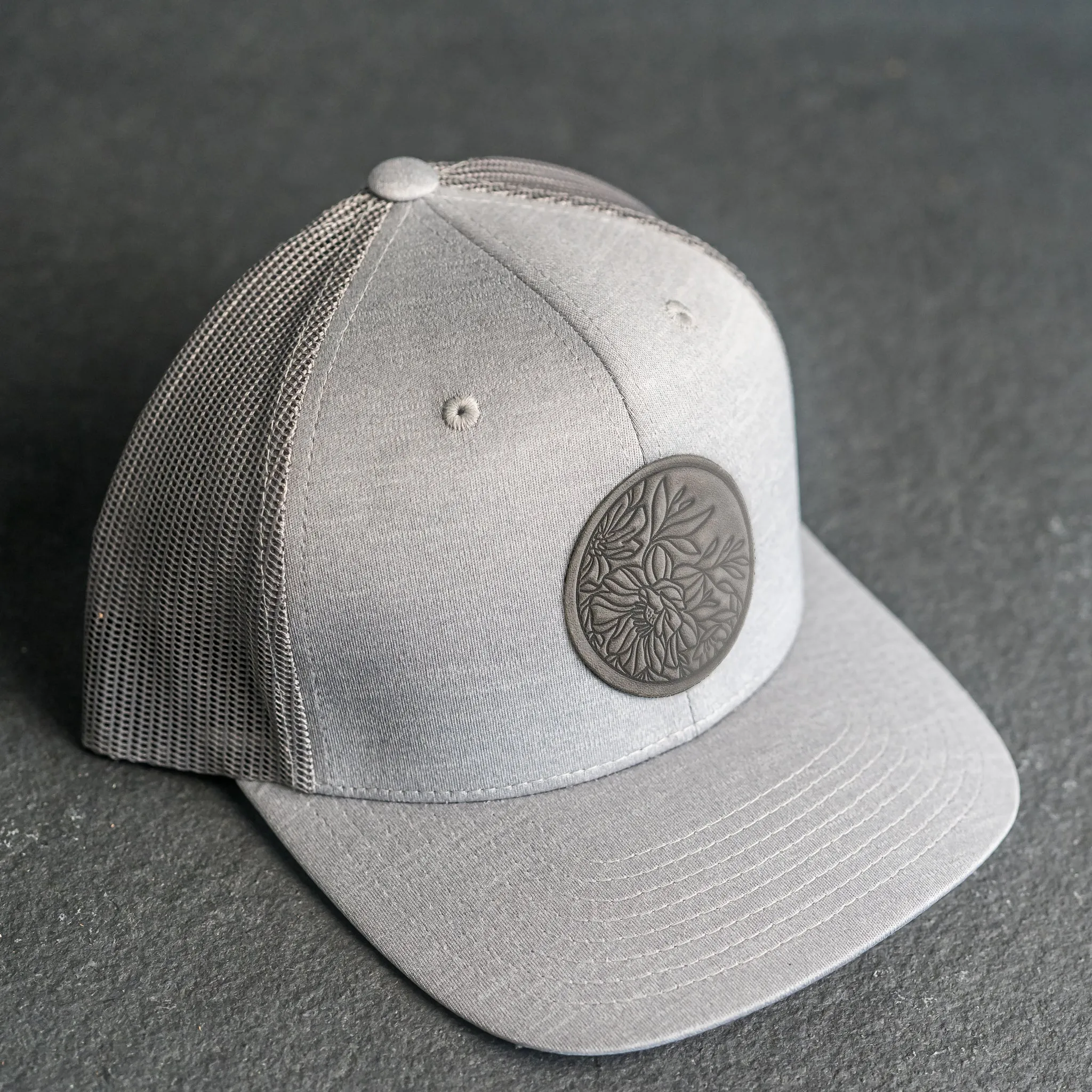 Leather Patch Performance Style Trucker Hat - Circle Patch - Floral Stamp