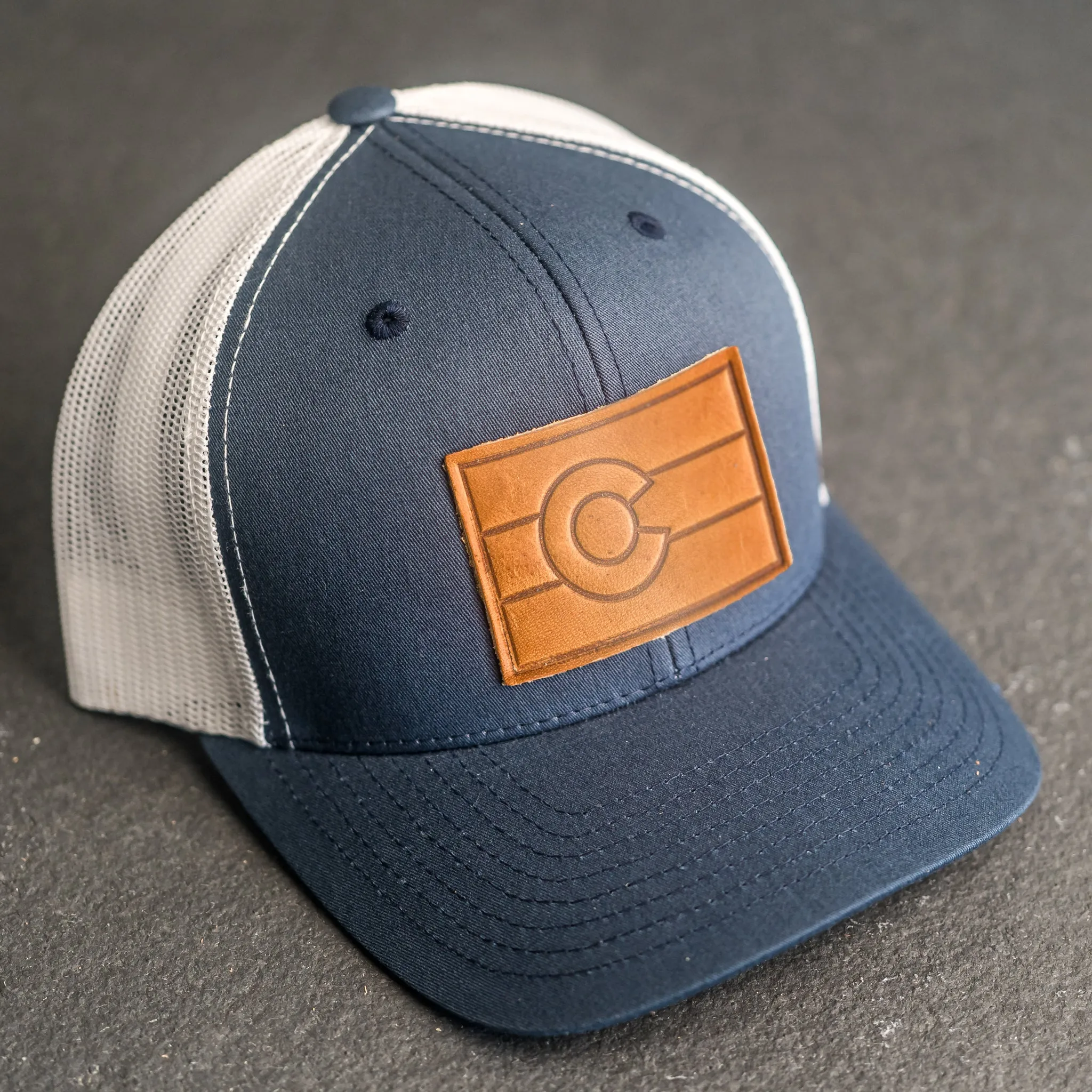 Leather Patch Trucker Style Hat - Colorado Flag Stamp